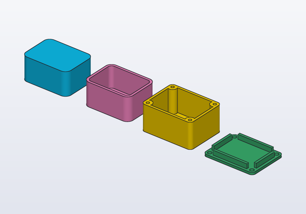 A rounded box, a tray, and the base and lid of an enclosure