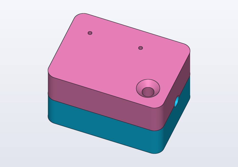 The mold closed: the funnel and two vents on top, a notch on each side