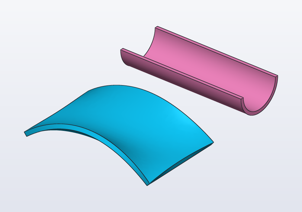 A saddle lofted through three curves and a gutter swept from a half circle, both thickened